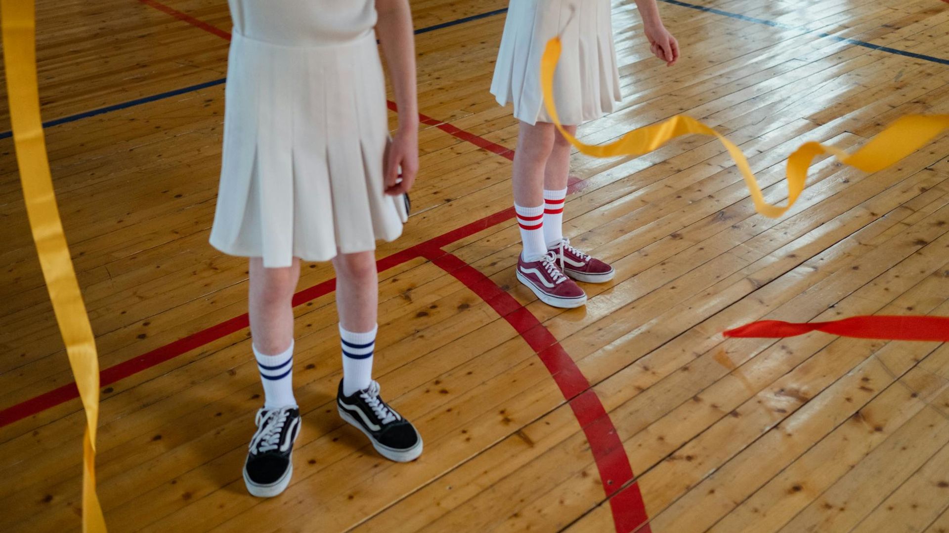 Active person doing rhythmic movements in a dark studio.